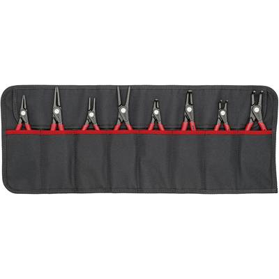 Un ensemble d'outils comprenant huit pinces rouges dans un sac en tissu noir.