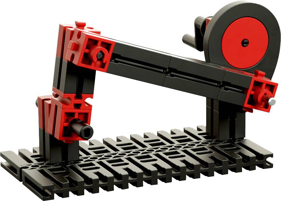 Un modèle mécanique avec des pierres de construction rouges et noires. Il représente un bras sur une base mobile, ressemblant à un levier.