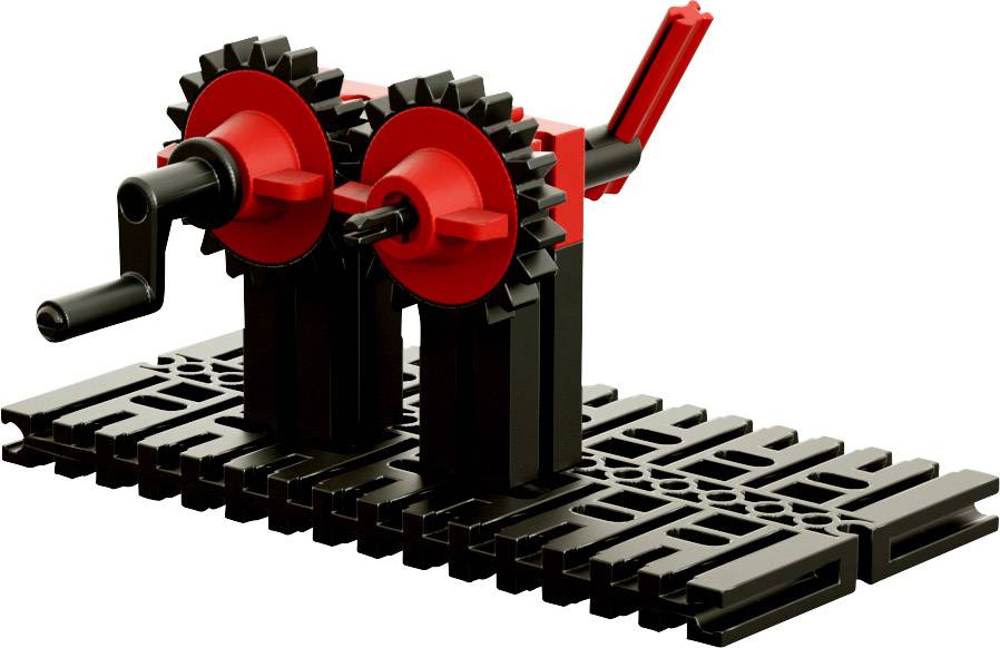 Un modèle en briques Lego noires et rouges représente un mécanisme d'engrenages avec deux manivelles rotatives sur un socle rectangulaire.