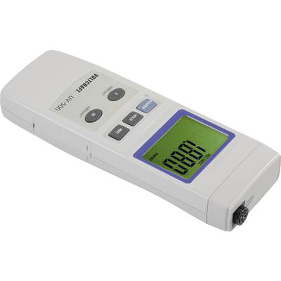 Voltmètre numérique posé sur une table, affichant 0,00 V sur un écran vert, avec des touches de fonction au-dessus.