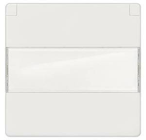 Un boîtier rectangulaire blanc en plastique avec une section transparente au centre, probablement une partie d'un appareil électrique ou d'un interrupteur.