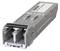 Un module SFP Siemens argenté, rectangulaire et compact, destiné à connecter des câbles réseau. Adapté pour des transmissions de données rapides dans les systèmes de réseau.
