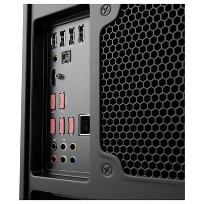 Gros plan du panneau arrière d'une tour d'ordinateur de bureau avec plusieurs ports USB, prises audio et une grande grille de ventilation en nid d'abeille.