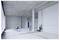 Deux ouvriers du bâtiment portant des gilets de sécurité utilisent des lignes laser rouges pour aligner des panneaux de cloison sèche à l'intérieur d'un bâtiment en construction. Un trépied est installé au centre.