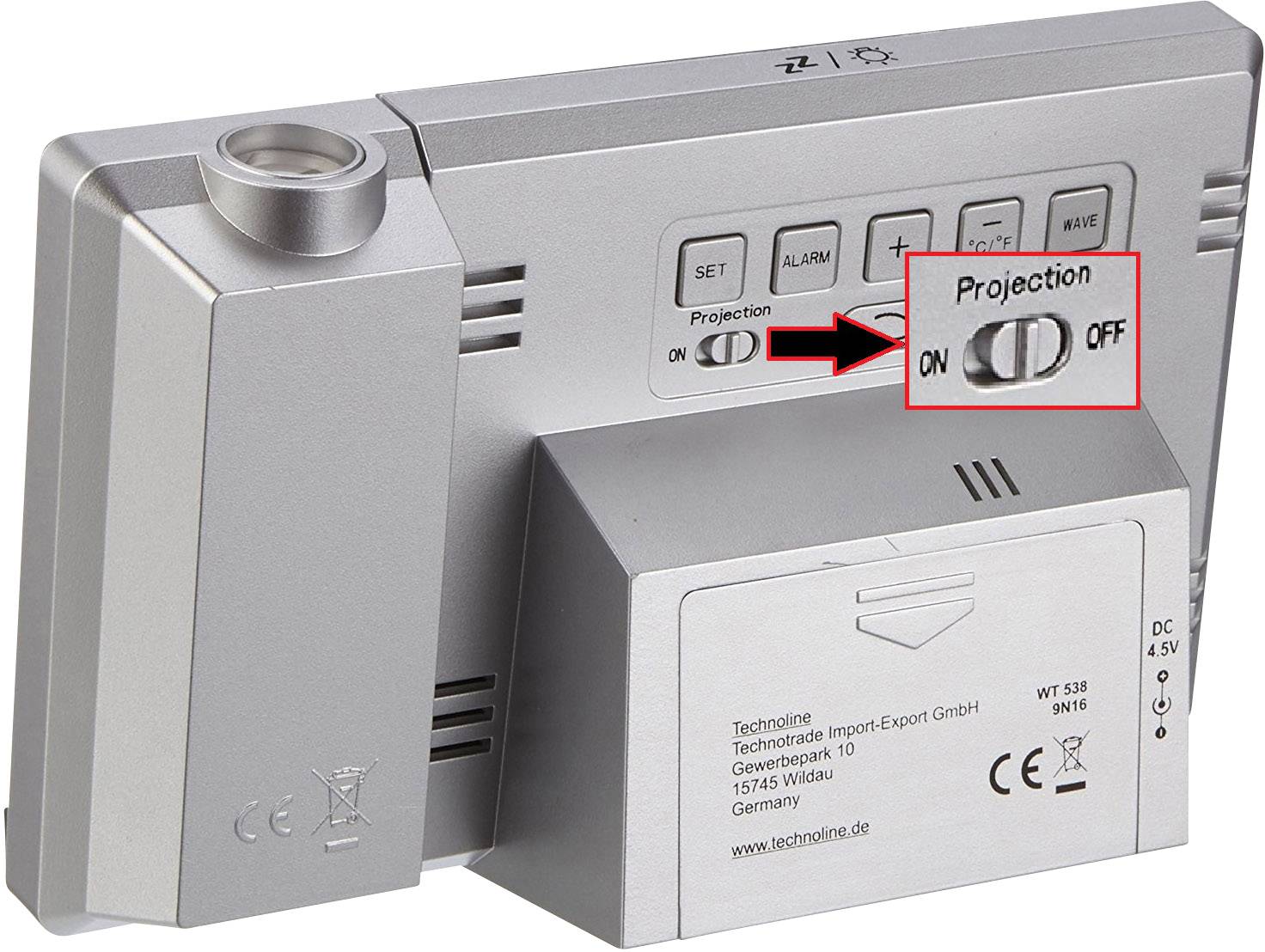 Horloge de projection en argent. L'accent est mis sur l'interrupteur à bascule pour la fonction de projection, avec l'indication « Projection ON/OFF ».