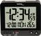Montre numérique avec boîtier noir affichant "PM 12:34" et "26,5°C". En bas "12:00 LUN" avec fonction alarme. Affichage de la température à gauche.