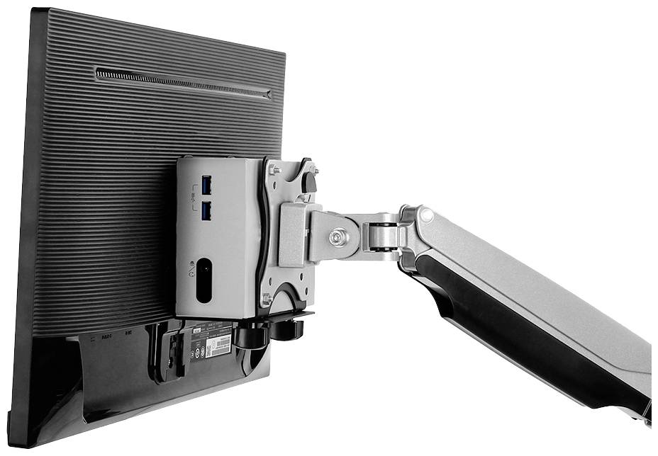 Un écran d'ordinateur, sur lequel est fixée une petite boîte informatique avec plusieurs ports USB, est maintenu par un bras articulé stable.