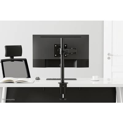 Un bureau moderne et ergonomique équipé d'un bras de support pour moniteur, sur lequel un écran est installé. À côté, une chaise et un livre ouvert.