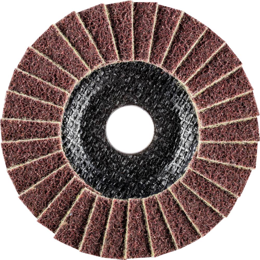 Un disque de meulage circulaire composé de couches radiales superposées de matériau abrasif brun autour d'un anneau central.