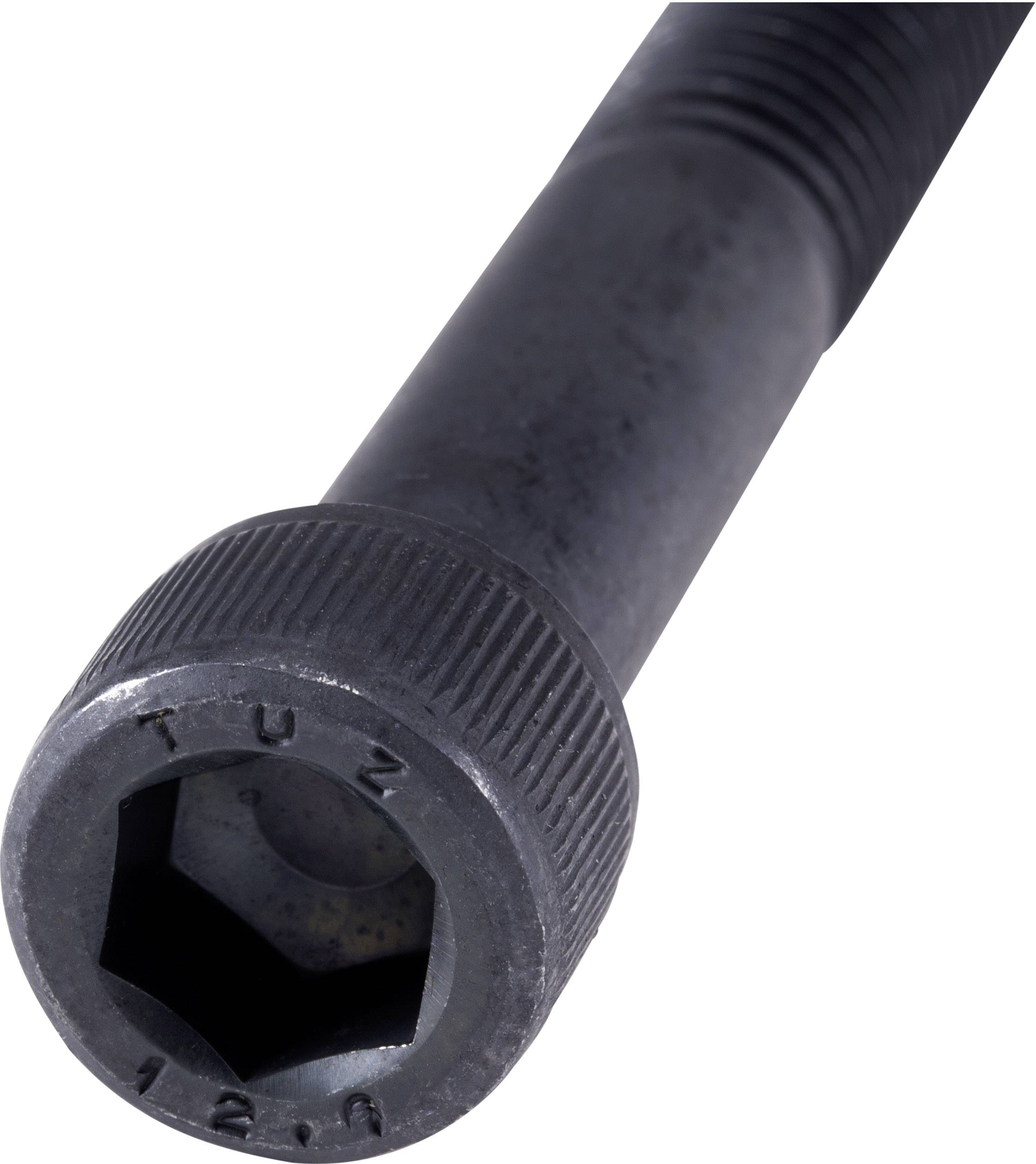 Gros plan d'une clé hexagonale noire, probablement en acier, portant l'inscription 'TUZ 12.8' sur le capuchon.