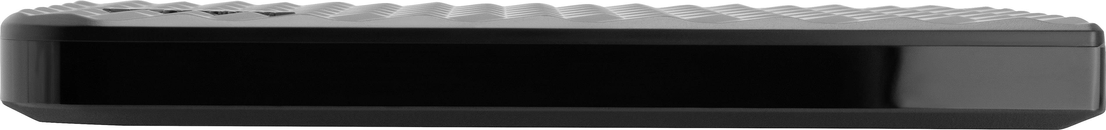 Un disque dur externe noir avec un couvercle structuré, utilisé pour le stockage de données.