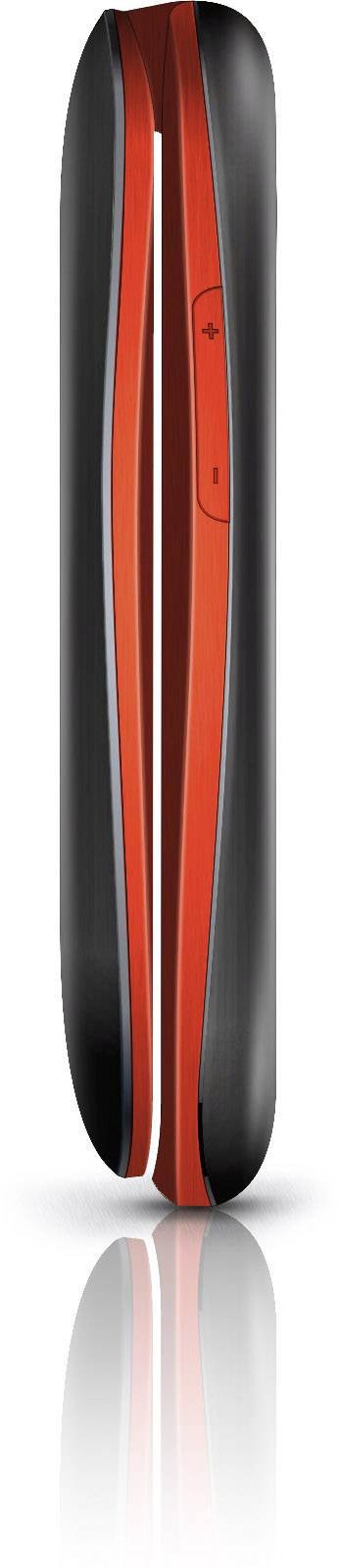 Un appareil élégant, moderne, noir et rouge avec des angles arrondis et une surface réfléchissante, ressemblant à une télécommande.