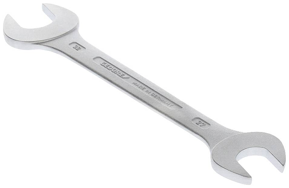 Une clé à molette en argent avec une ouverture de 8 et 9 mm, fabriquée en Allemagne.