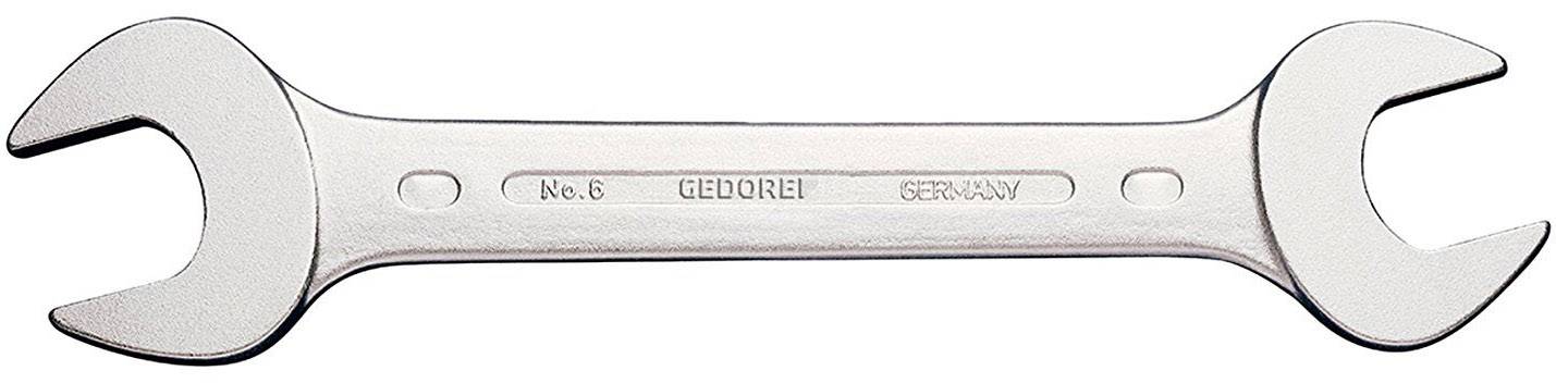 Une clé à fourche en argent avec deux extrémités de tailles différentes. Inscription au milieu : « No. 6 GEDORE GERMANY ».