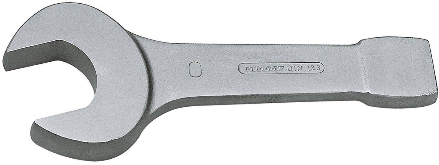 Une clé à fourche chromée, ouverte à une extrémité, sur un fond clair. Adaptée pour serrer ou desserrer des écrous.