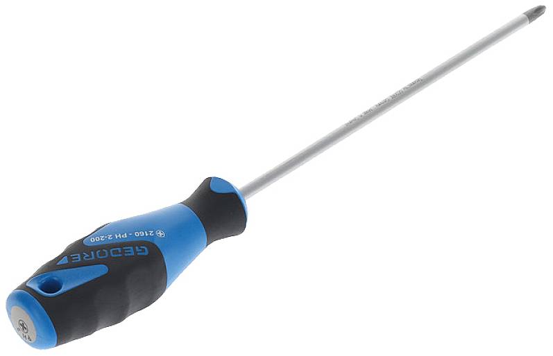 Un tournevis cruciforme long avec une poignée bleu-noir repose en diagonale sur une surface blanche.