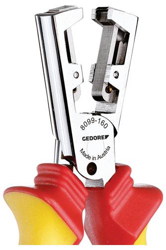 Une paire de dénude-fils isolés avec des poignées rouges et jaunes, présentant des dents de préhension métalliques et portant la mention « Fabriqué en Autriche » sur l'outil.