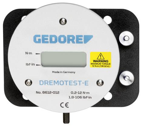 Testeur de couple numérique marqué GEDORE DREMOTEST-E, affichant un écran LCD, les unités de couple N·m et lbf·in, et un avertissement pour le couple maximal 12 N·m (106 lbf·in).