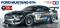 Un modèle réduit de Ford Mustang GT4 à l'échelle 1:10, présenté comme un véhicule de course télécommandé. Fabricant : Tamiya.