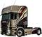 Un camion Scania marron avec des motifs graphiques distinctifs sur le côté est stationné latéralement dans l'image.