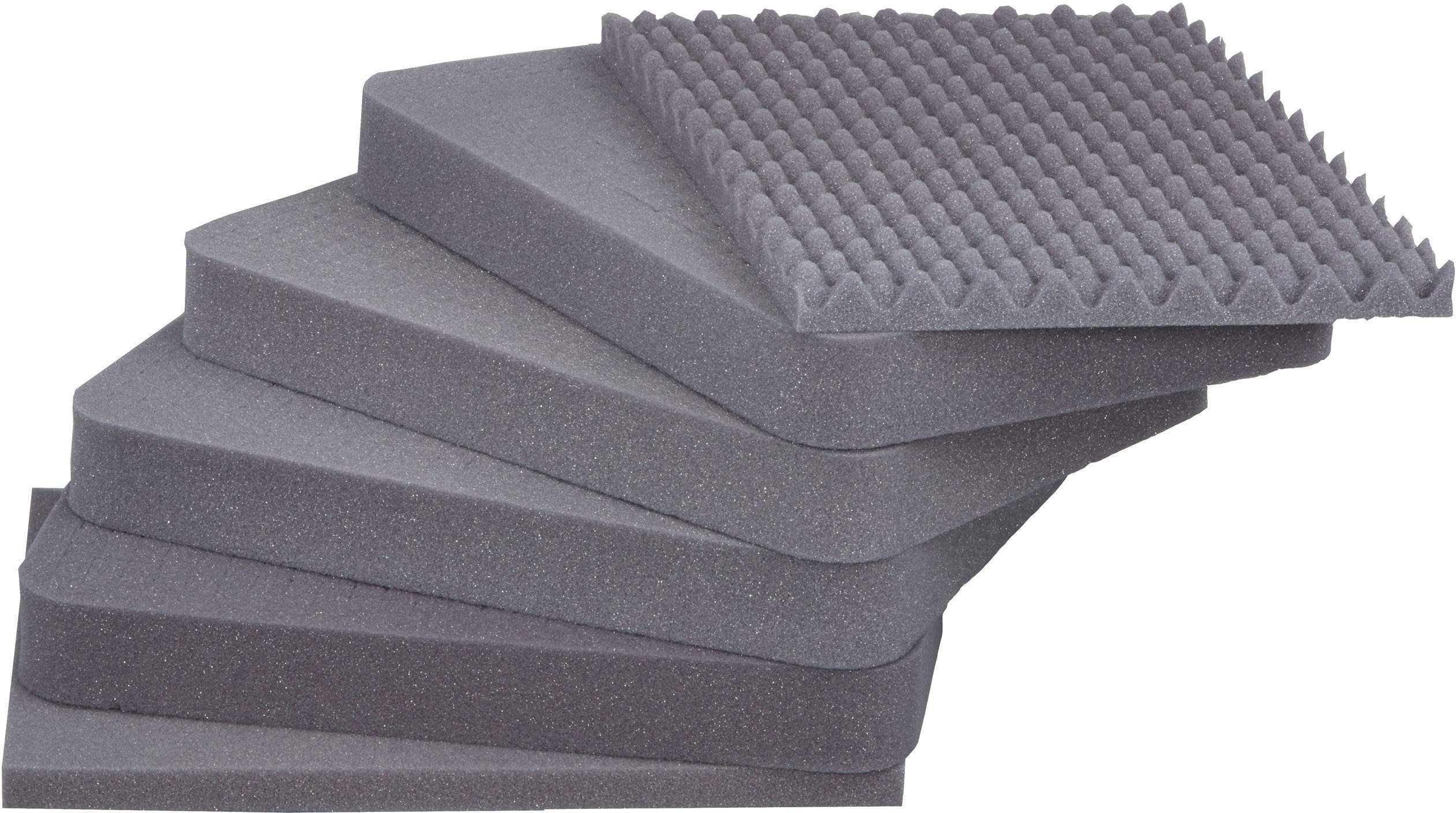 Six tapis en mousse gris empilables, le supérieur avec des picots. Servent à l'isolation acoustique.