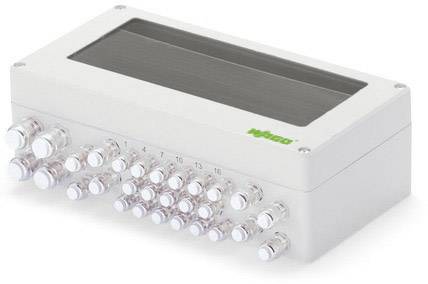 Un appareil électronique blanc rectangulaire avec plusieurs ports de connexion transparents à l'avant et une fenêtre sombre en haut.