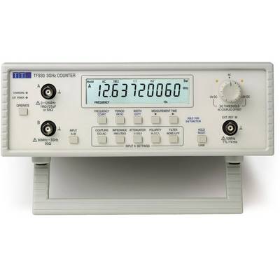 Compteur de fréquence affichant '12,637720060 MHz'. Contient des éléments de commande pour la mesure de signal et divers réglages sur la face avant.