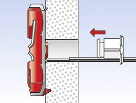 Dessin technique d'une fixation par cheville dans un mur, montrant la cheville fixée avec un élément de fixation rouge et une flèche pointant vers la vis.