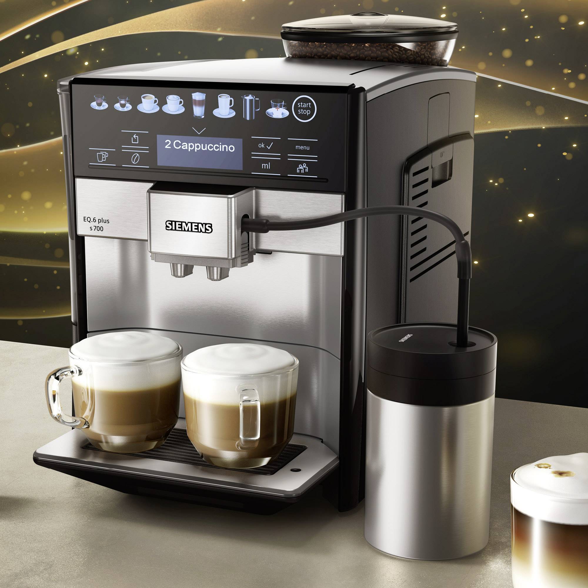 Un machine à café automatique avec deux tasses à café. L'écran affiche 'Cappuccino'. Un réservoir de lait est connecté.