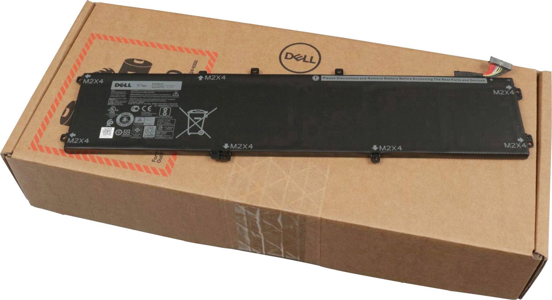 Batterie d'ordinateur portable Dell, rectangulaire, noire, posée sur un emballage en carton brun avec le logo Dell.