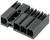 Un connecteur noir en plastique avec plusieurs cavités rectangulaires et des nervures sur la surface supérieure, typiquement utilisé pour des connexions électriques.