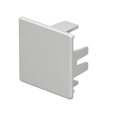 Couvercle en plastique blanc pour une multiprise ou un chemin de câbles.