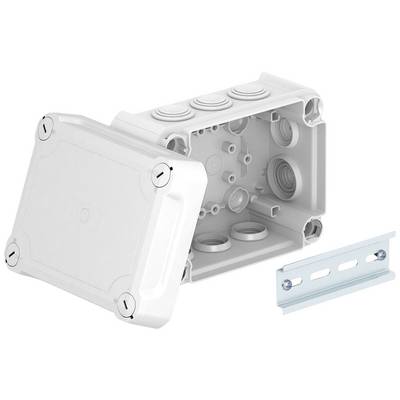 Une boîte de dérivation blanche ouverte avec un couvercle amovible et plusieurs passe-câbles, à côté de laquelle se trouve un support métallique.