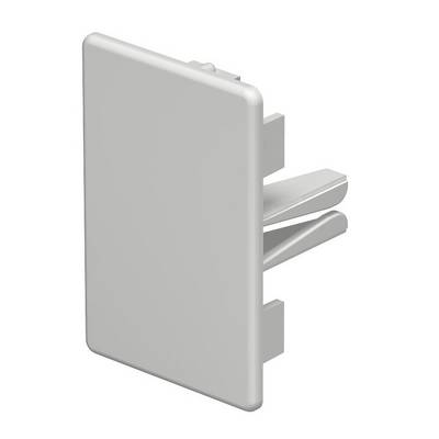 Une pièce rectangulaire en plastique gris clair avec deux pinces intégrées à l'arrière, probablement destinée à être fixée sur une surface.