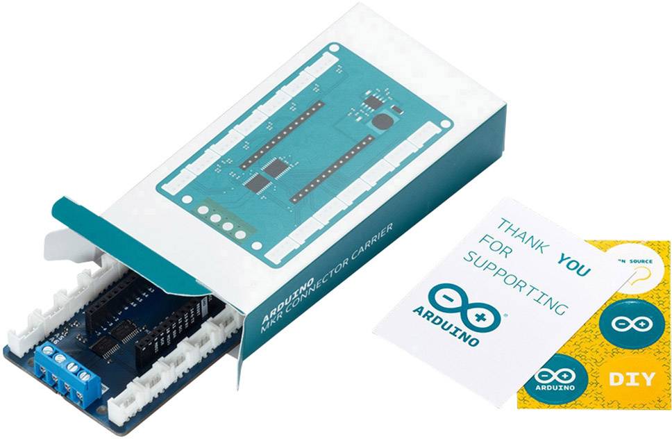 Carte Arduino dans un boîtier ouvert, accompagnée d'un manuel et d'une carte de remerciement pour le soutien à la communauté Arduino.
