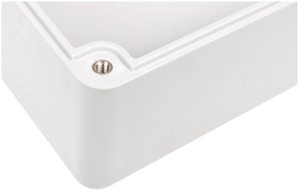 Coin d'un boîtier en plastique blanc avec une vis métallique visible.