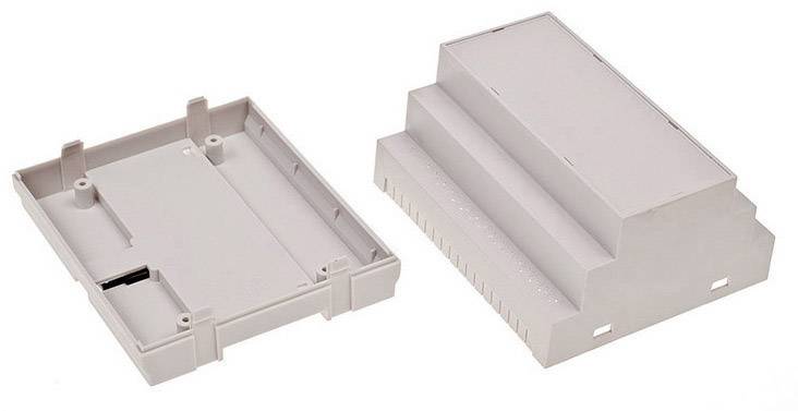 Deux boîtiers en plastique gris rectangulaires. Boîtier ouvert à gauche, boîtier fermé empilable à droite. Boîtiers destinés au montage électronique.