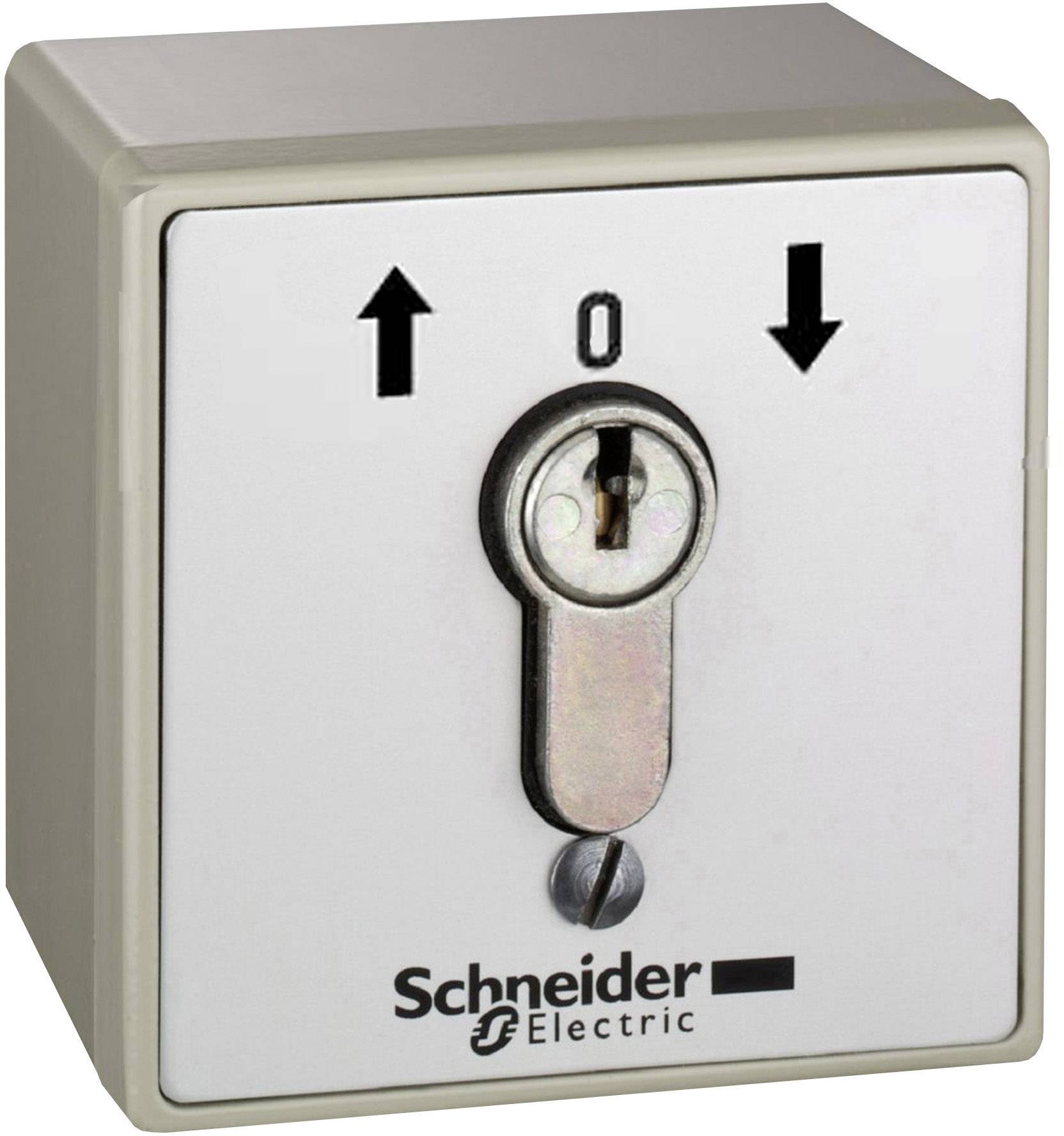 Interrupteur à clé de la marque Schneider Electric avec des flèches indiquant les mouvements ascendants et descendants pour mettre sous tension ou hors tension des circuits électriques.