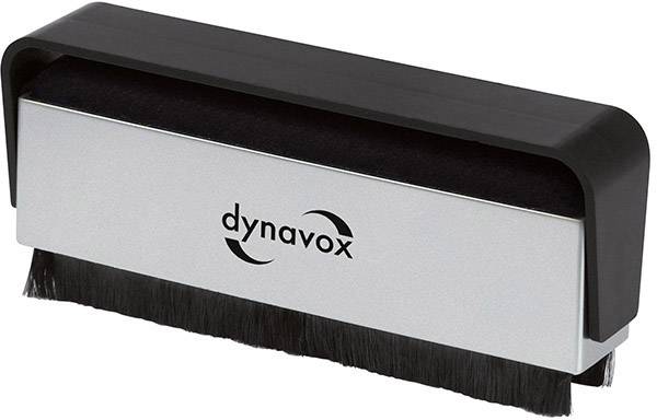 Brosse rectangulaire avec un manche noir et des poils, portant l'inscription 'dynavox' sur la face avant du boîtier argenté.