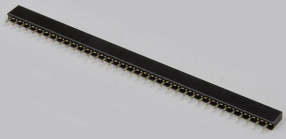 'Rangée de barrettes de connexion, noires avec des contacts dorés, sur un fond gris. Composant électronique pour connexions.'