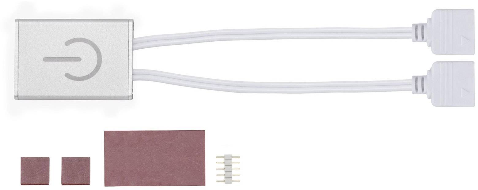 Un accessoire électrique avec deux câbles. À côté se trouvent trois tampons rouges et un petit élément de connexion.