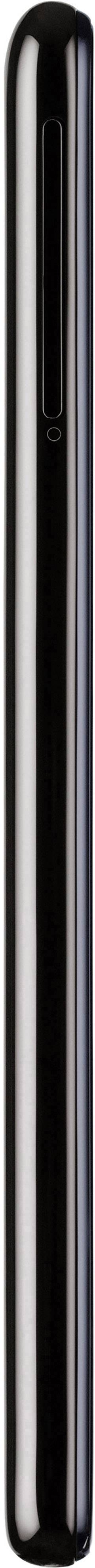 Un stylo noir et brillant positionné verticalement sur un fond blanc.