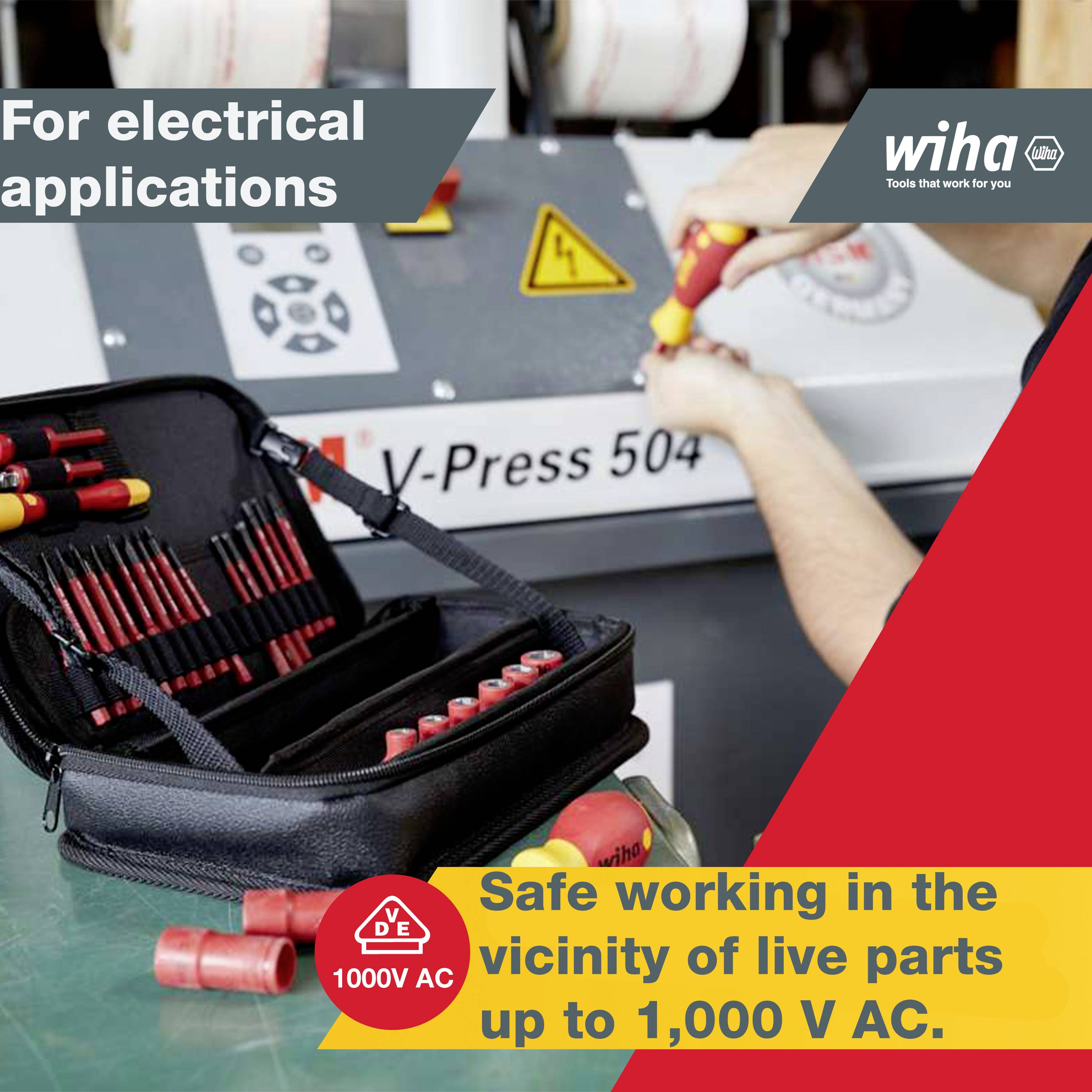 Une personne travaille avec un jeu d'outils sur une installation électrique portant l'inscription 'V-Press 504'. Le texte indique qu'il est possible de travailler en toute sécurité jusqu'à 1000V AC.