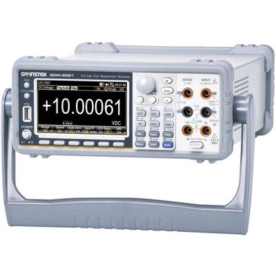Multimètre numérique avec affichage de '+10.00061 VDC', plusieurs boutons et bornes pour les mesures électriques.