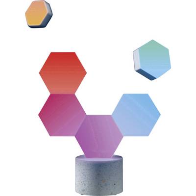 Des modules hexagonaux colorés en rouge, violet et bleu sont disposés sur un cylindre gris, évoquant une œuvre d'art moderne.