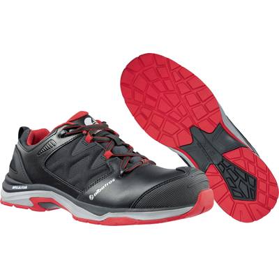 Chaussure de sécurité noire avec semelle rouge et lacets rouges. Présentée de côté et par le dessous. Adaptée aux environnements de travail.