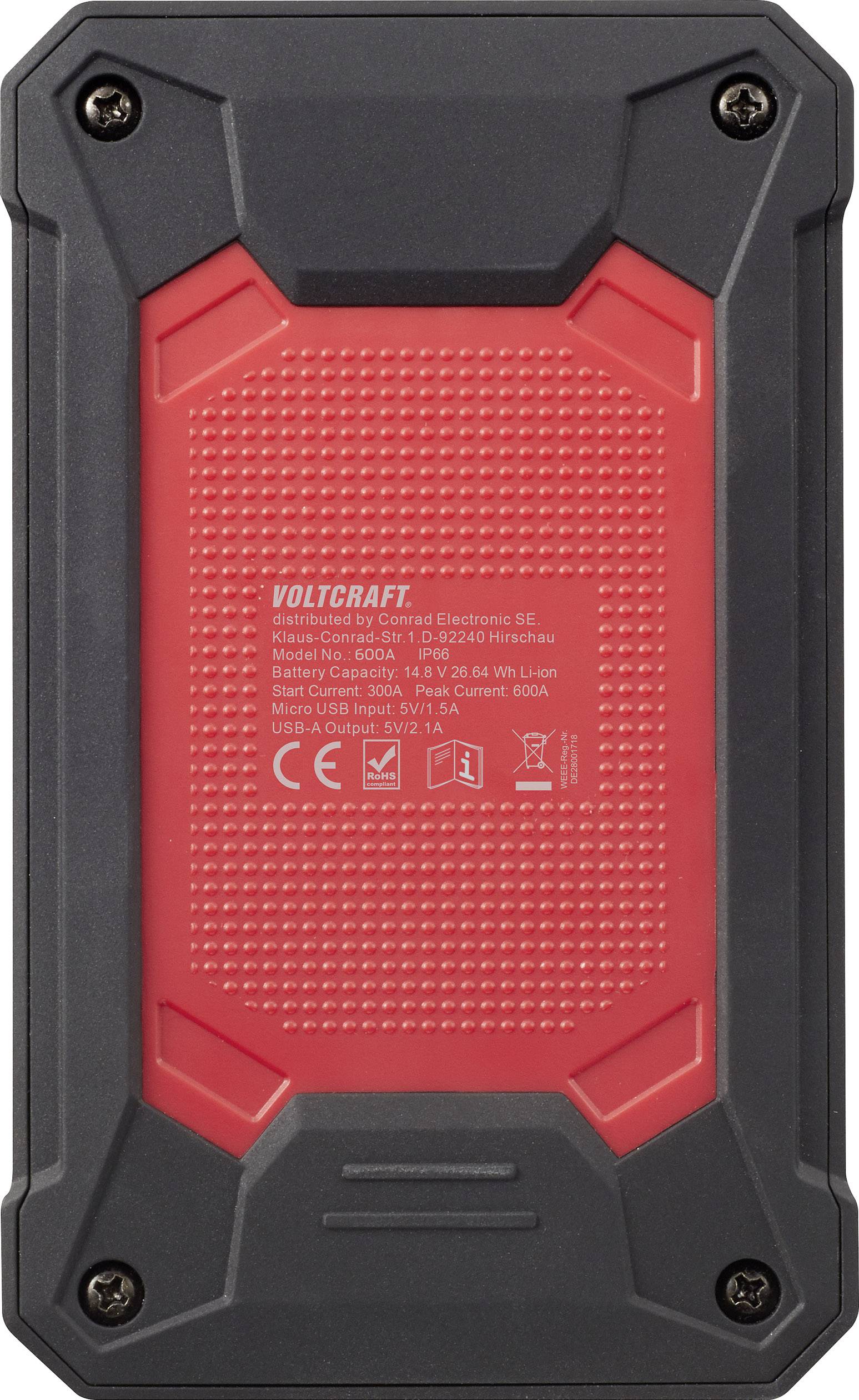 Arrière d'un appareil portable avec des avertissements, des informations sur la batterie et le chargement. Boîtier rouge et noir, quatre vis visibles.