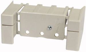 Un support de fusible électrique beige avec trois trous de fixation et un petit symbole de foudre sur la face avant.