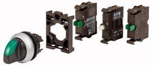 Interrupteur avec levier vert et structure modulaire. Composants de l'interrupteur démontés.