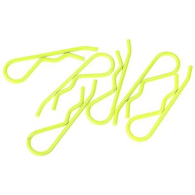Plusieurs clips en fil jaunes ondulés sont dispersés.
